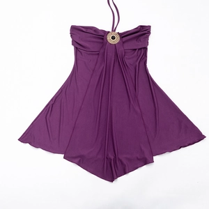 Detail of purple halter dress featuring ruched chest and decorative gold metal buckle
