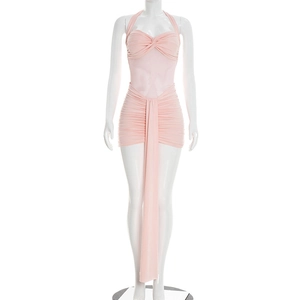 Detail of light pink halter mini dress with mesh patchwork and ruched fabric design