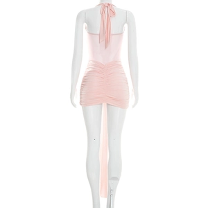 Detailed back view of light pink halter mini dress with ruched mesh and tie details