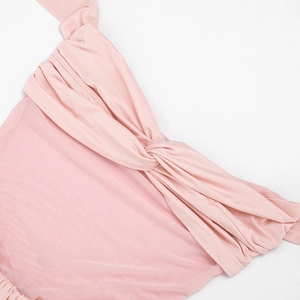 Detail of light pink dress featuring center twist knot and mesh splicing textures