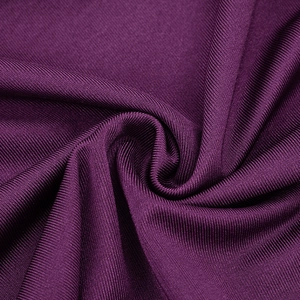 Close-up of deep purple ribbed knit fabric texture showing vertical stripes and soft pleats