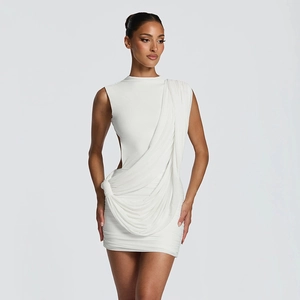 Detail of white sleeveless mini dress with draped Greek style and ruched texture