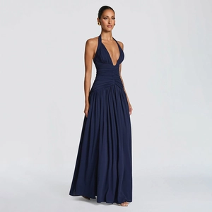 Detailed view of elegant deep V-neck and halter neckline on a dark blue maxi dress