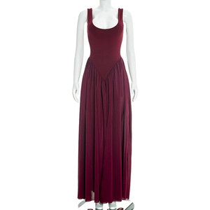 Detail of burgundy sleeveless dress featuring square neckline and pleated chiffon skirt