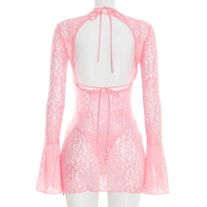 Detail of pink lace dress featuring flared sleeves and an elegant open back design