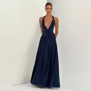 Detail of elegant navy blue halter maxi dress with deep V-neck and ruched waist detail