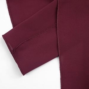 Close-up of wine red chiffon dress showing precision edge stitching and fine fabric texture