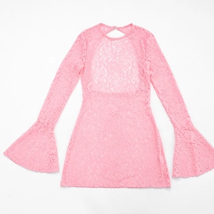 Detail of pink floral lace beach dress featuring flared long sleeves and back cutout