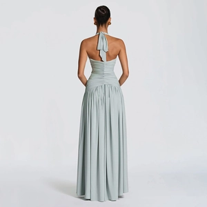 Detailed back view of light blue halter neck maxi dress with elegant bow and pleated skirt