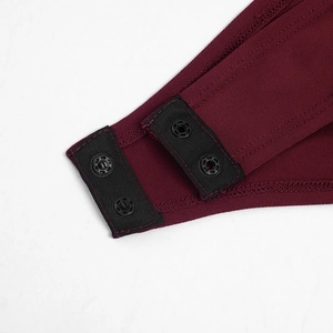 Detailed macro view of the bodysuit bottom with secure metal snap buttons and ribbed knit fabric