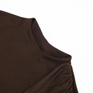 Detailed macro view of dark coffee sleeveless dress showing fine knit texture and neckline