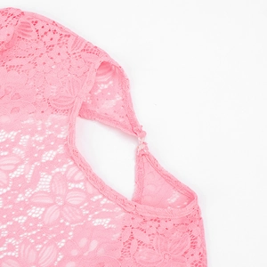 Close-up of pink floral hollow lace fabric with exquisite button closure detail
