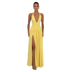 Elegant bright yellow halter neck maxi dress with deep V-neck and sexy high side slit