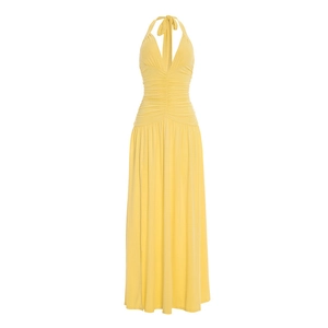 Detail view of bright lemon yellow halter neck maxi dress with ruched waist and slit