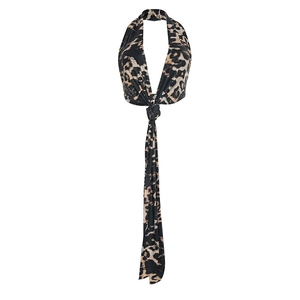Detail of leopard print halter top showing deep V-neckline and tie-front ribbon design