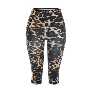 Detail of high-waisted leopard print capri leggings with elastic fabric and pattern