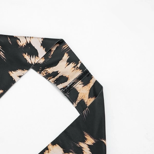 Close-up of leopard print fabric detail showing high-quality stitching and twill texture