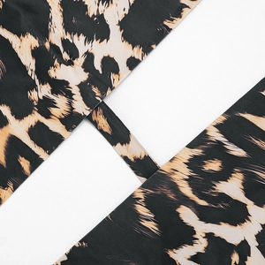 Detailed view of leopard print fabric texture and neat stitching on a halter neck top