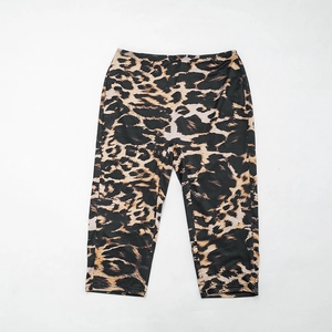Detailed close-up of high-elastic cropped leggings with bold leopard print pattern