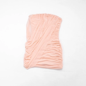 Detailed view of the soft pink ruched mesh fabric on a strapless bodycon dress