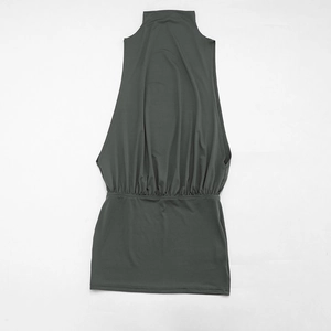 Detailed view of the dark grey-green mini dress with turtleneck and waist pleating details