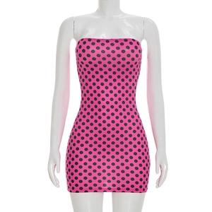 Detail of pink bodycon mini dress with black polka dots on white mannequin