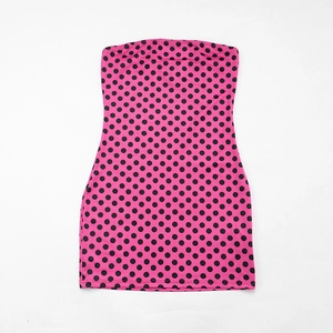 Detailed flat lay view of pink polka dot strapless mini dress with black spots