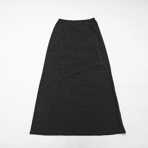 Detailed view of black polka dot chiffon maxi skirt with elegant A-line silhouette