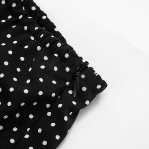 Detail of elastic waist with black invisible zipper on white polka dot chiffon skirt