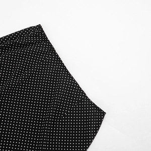 Detail of the hidden zipper on a black and white polka dot chiffon skirt waist