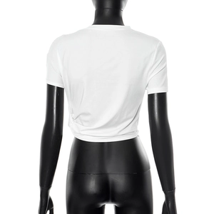 Back view of a white cropped T-shirt featuring a twisted hem and slim fit on a mannequin