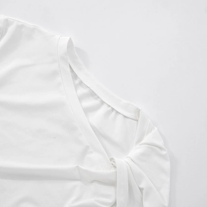 Close-up of precise double stitching and edge finishing on white cropped t-shirt