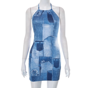 Detail view of denim print texture and halter neck stitching on a mini dress