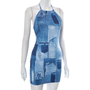 Detailed view of backless halter dress featuring blue denim print and distressed patterns