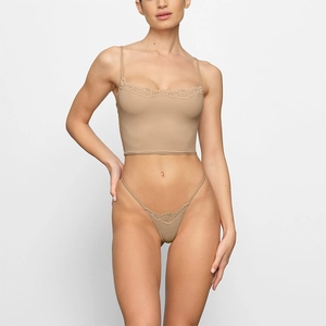 Detailed view of beige lace trim on the sexy crop top camisole and matching lingerie set