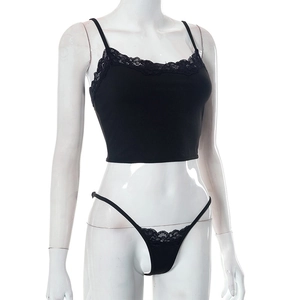 Detail shot of black crop top with eyelash lace trim and matching G-string lingerie set