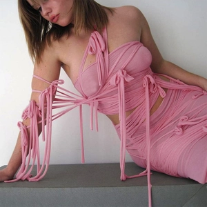 Pink strapless wrap crop top and matching mini skirt set in trendy bandage style