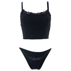 Detail of delicate floral lace trim on black sleeveless camisole and matching panties set
