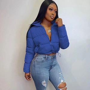 Detail view of royal blue puffer jacket with adjustable drawstring hem and zipper closure