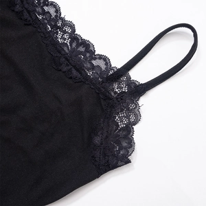 Detailed macro view of black camisole with delicate lace trim and thin straps