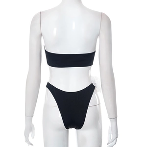 Rear view of black crop bikini set with 3D white floral detail on high-cut briefs