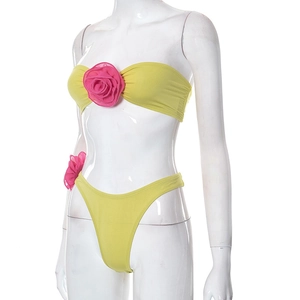 Close-up of bright yellow tube top with large fuchsia 3D silk rose flower detail