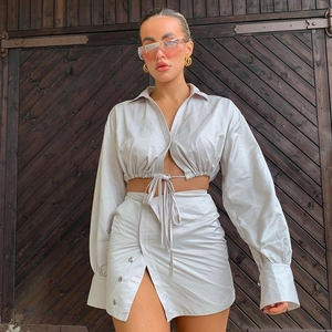 Women's summer two-piece grey set with cropped tie-waist top and slit skirt with metal buttons