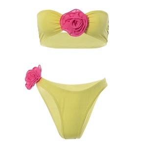 Detail of yellow bandeau bikini set featuring 3D pink chiffon flower decorations