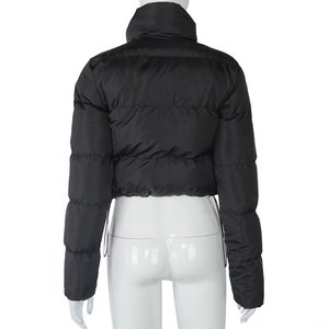 Detail of black glossy puffer jacket featuring drawstring hem and quilted back design