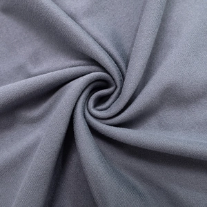 Foto macro de textura de tela de punto gris oscuro con costuras del vestido