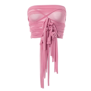 Detail of pink mesh tube top featuring wrap-around straps and long fringe tassels