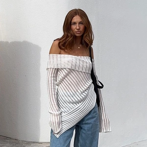 Detail of off-shoulder long sleeve striped top with ribbed texture and fold-over neckline