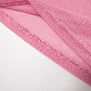 Close-up of pink mesh crop top showing precise double-stitched seams and breathable fabric
