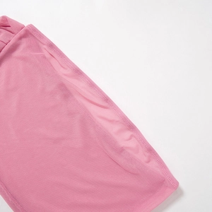 Close-up of pink mesh fabric with delicate double-needle stitching and fine texture